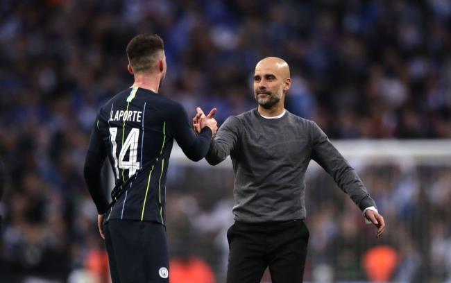 Laporte y Guardiola