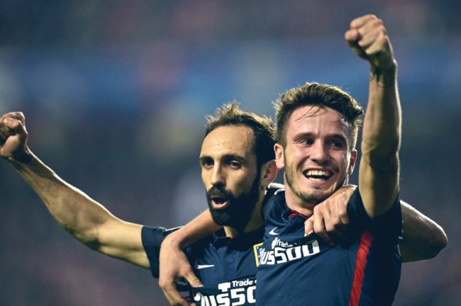 Saúl Ñíguez junto a Juanfran en un partido del Atlético