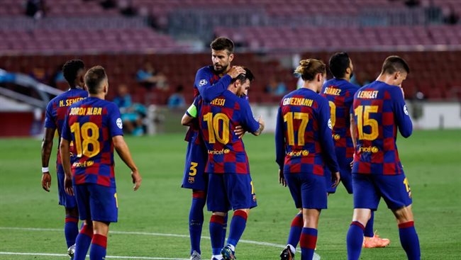 Messi y Pique celebrando un gol anoche contra el Nápoles